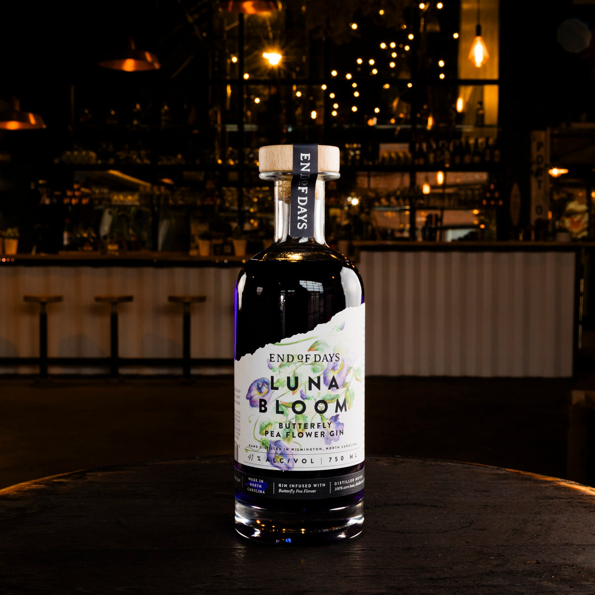 Luna Bloom Butterfly Pea Flower Gin bottle on a table, front label view
